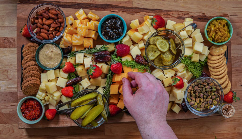 smoked cheese board with fruits and nuts
