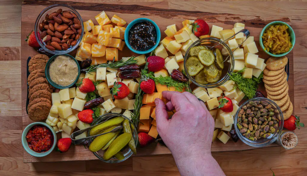 smoked cheese board with fruits and nuts