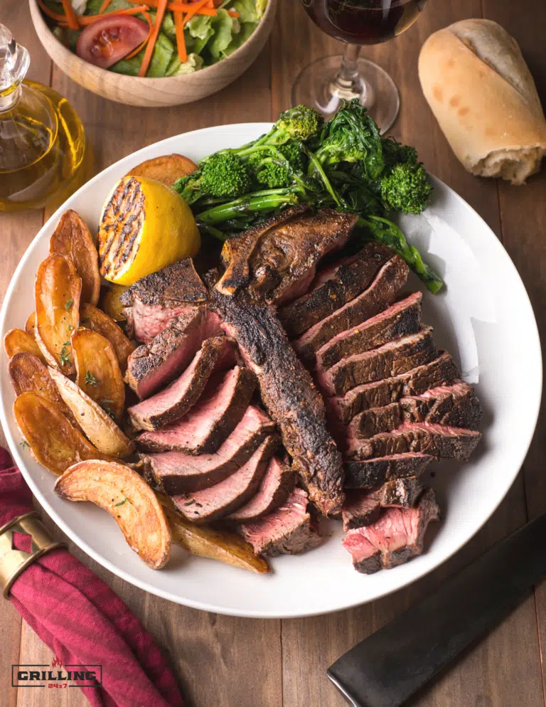 sliced porterhouse steak with broccoli and potatoes