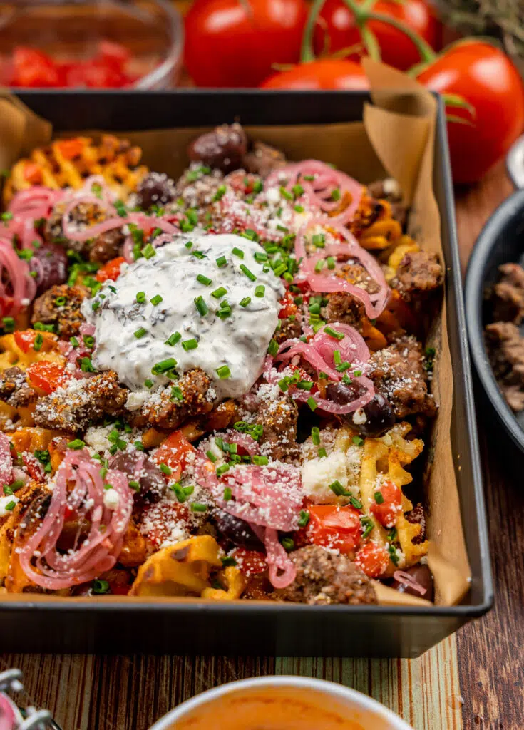 crispy waffle fries topped with feta, olives, tomatoes and ground lamb