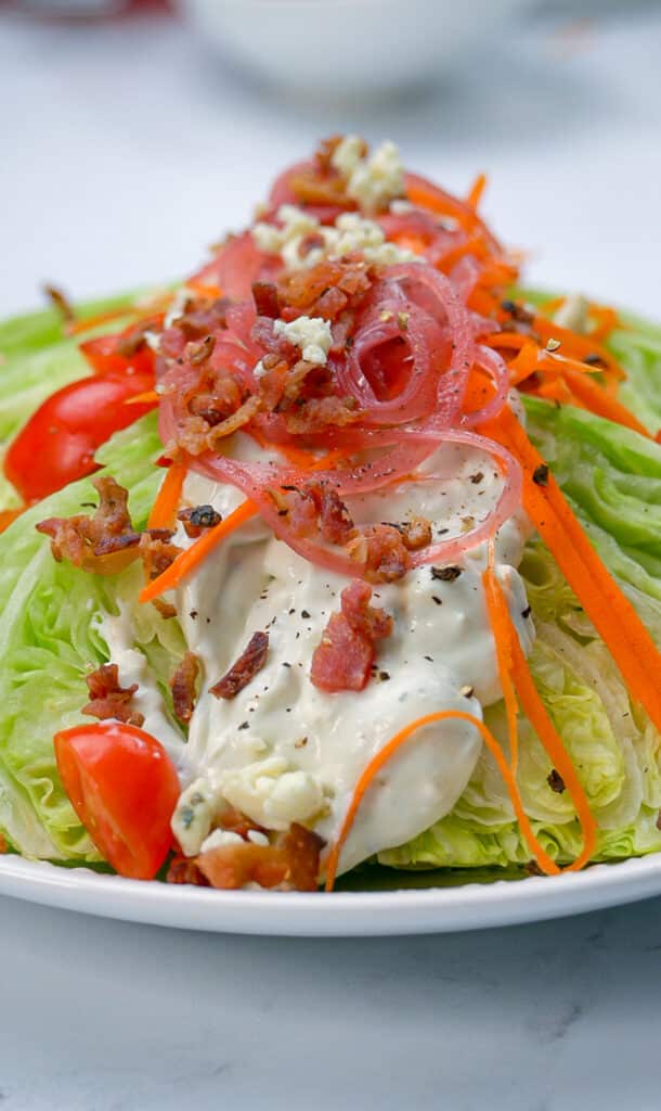 Wedge salad topped with homemade chunky bleu cheese