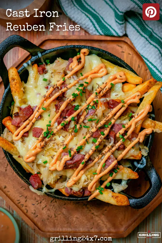 Cast iron loaded reuben fries on a cutting board