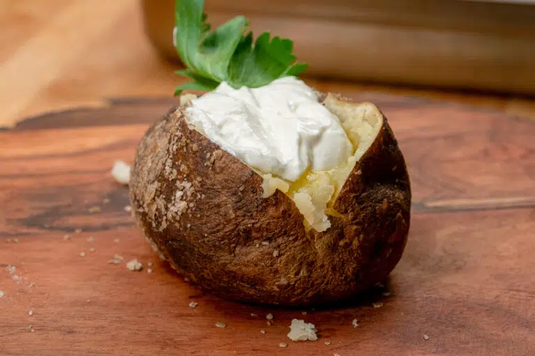 smoked baked potato with butter and sour cream