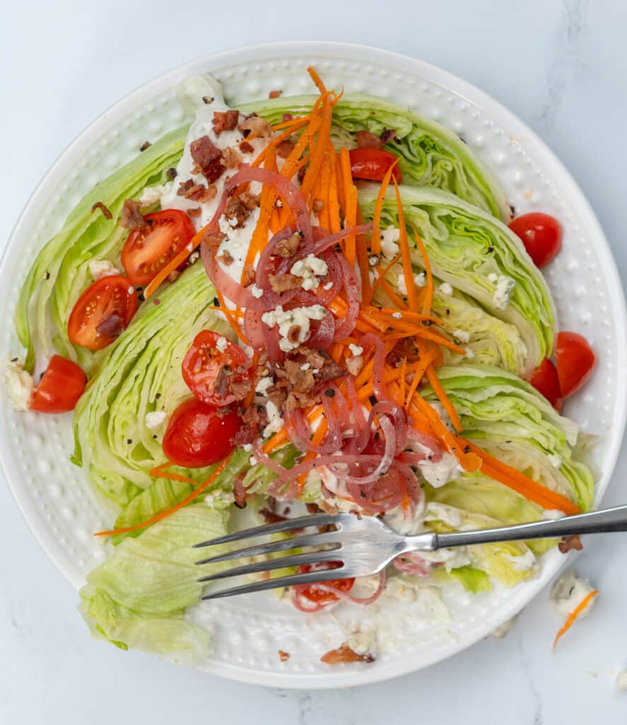 cut into a wedge salad with tomatoes and baccon