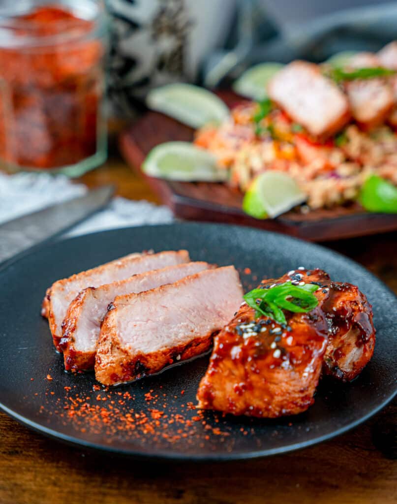 korean pork chops garnished with scallions and sesame seeds