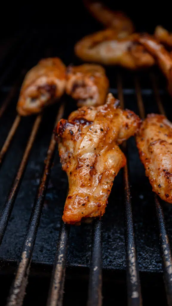 smoked chicken wing drum stick on the grill