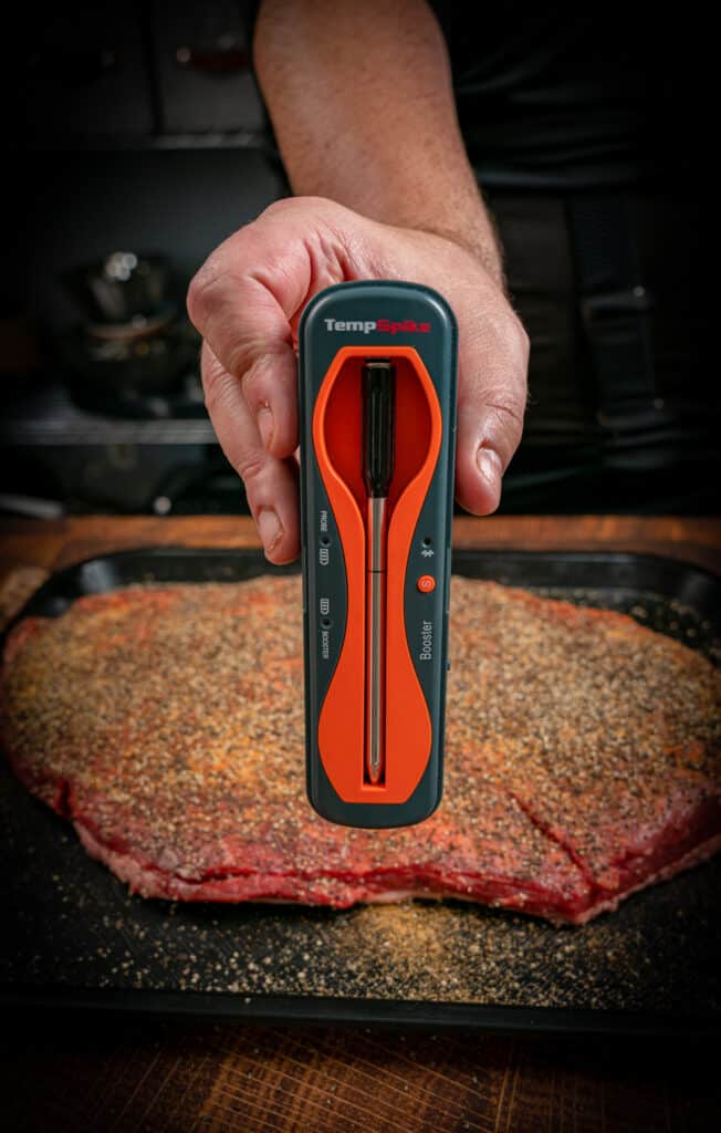 tempspike wireless thermometer with a raw brisket flat in the background