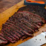 Sliced Beef brisket flat on a cutting board
