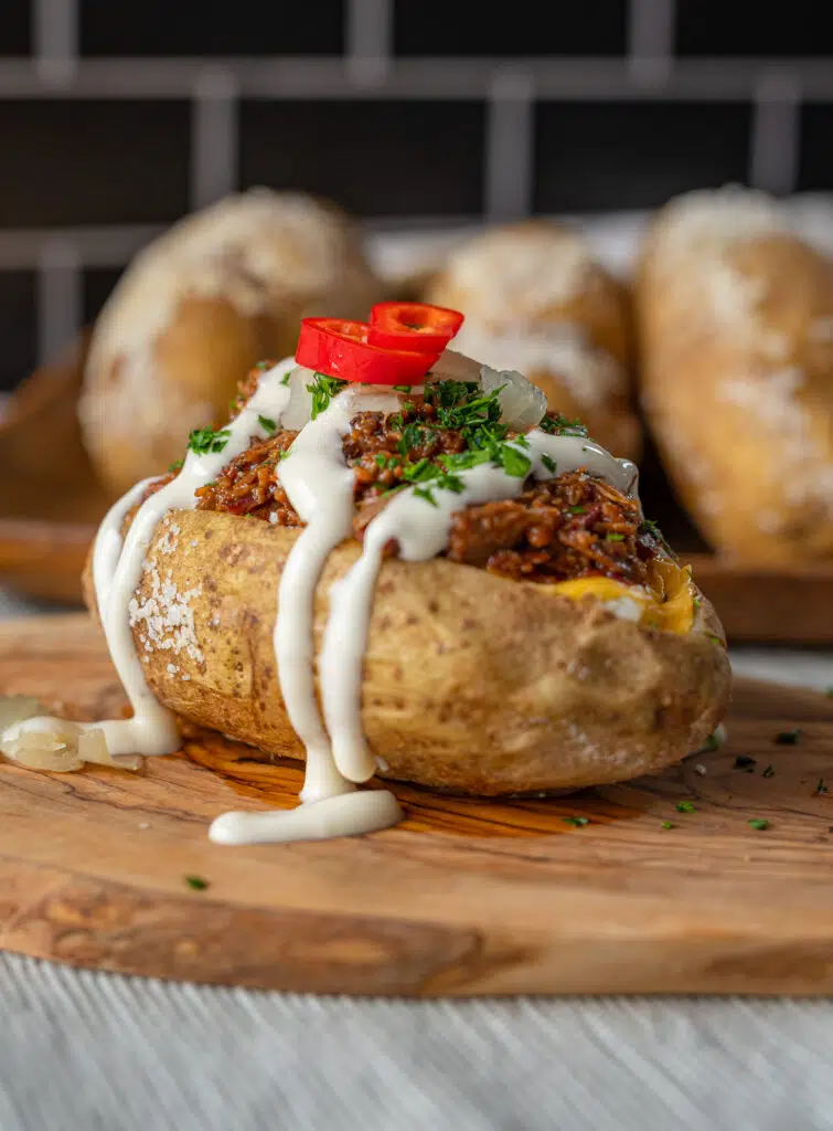 loaded brisket baked potato with cheese and ranch dressing