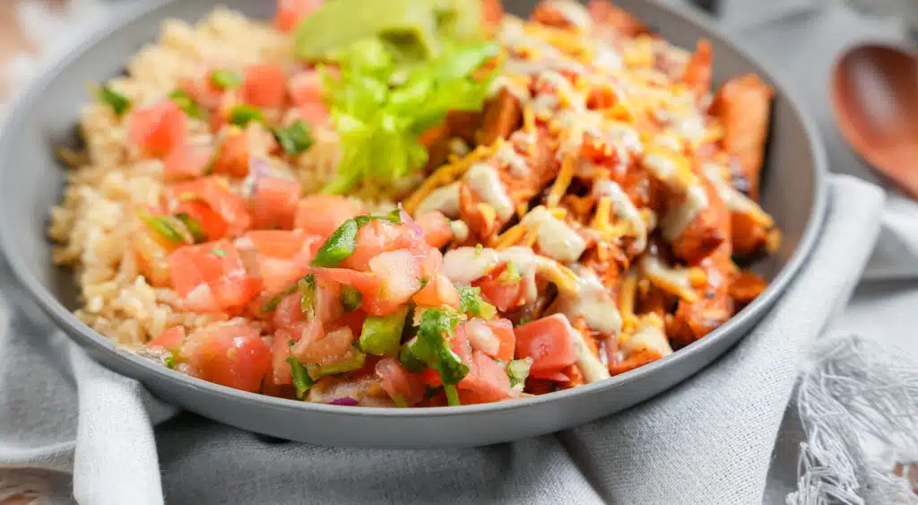 pico de Gallo made fresh and topped on a pork burrito bowl