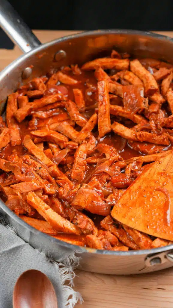 pan of simmered pork tenderloin for making burrito bowls