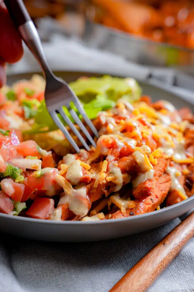 digging my fork into a burrito bowl using leftover pork