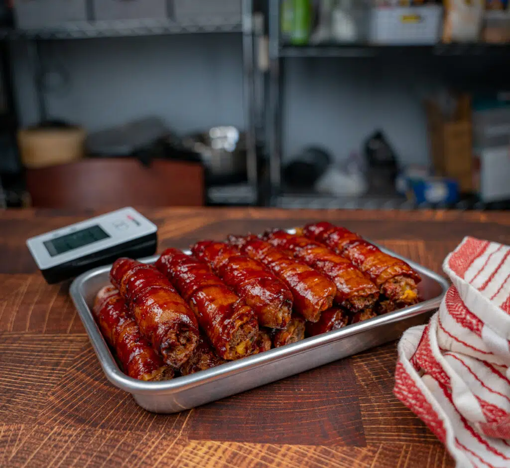 stack of bbq smoked manicotti shells stuffed with beef and cheese