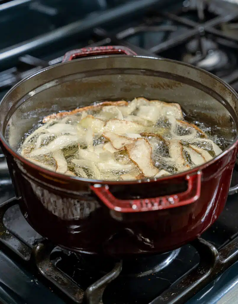 frying potato peels in a dutch oven