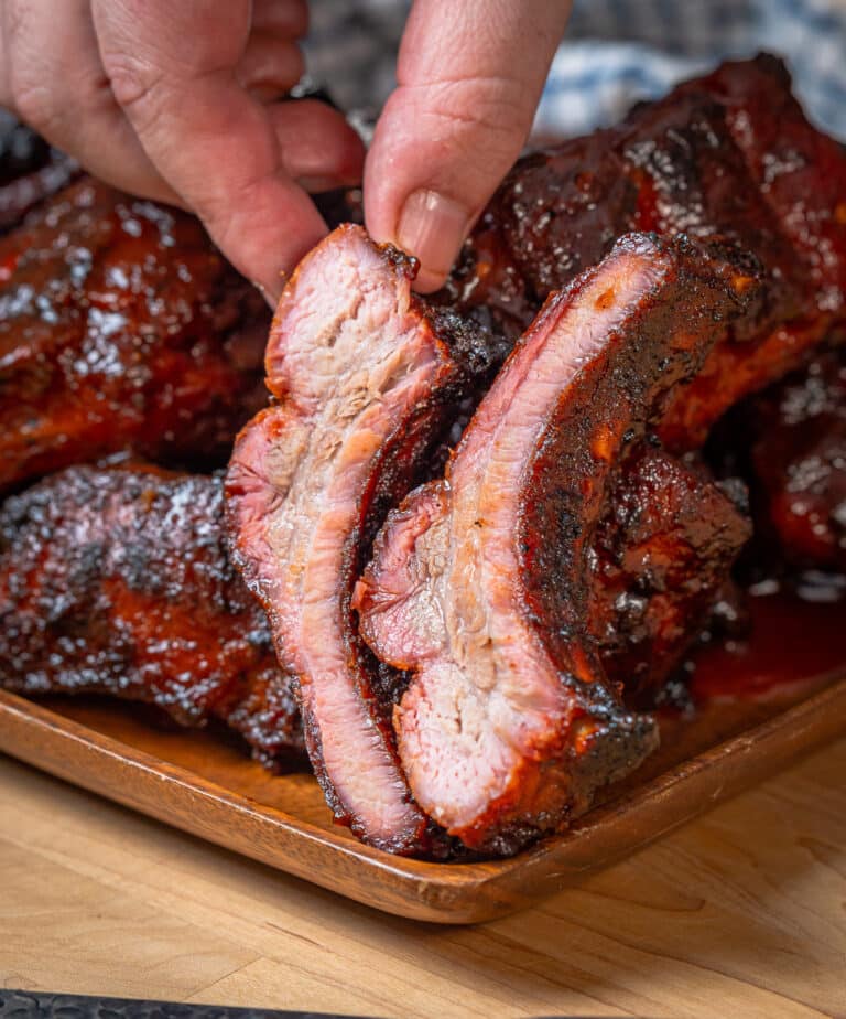 Sliced baby back ribs brushed with bbq sauce