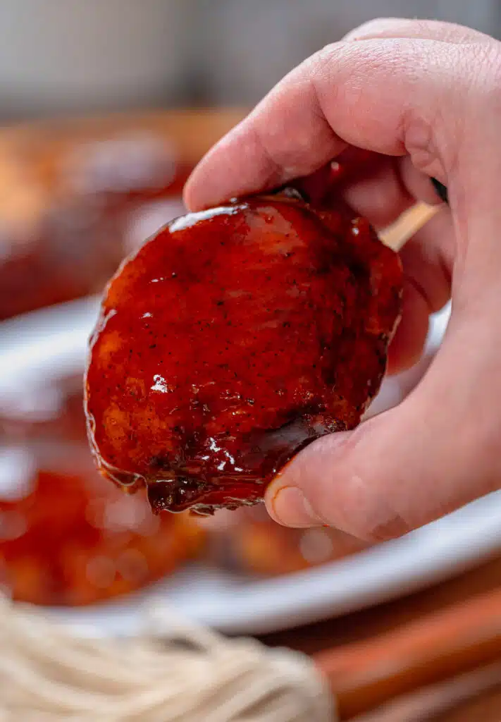 chicken thigh with bbq sauce in my hand