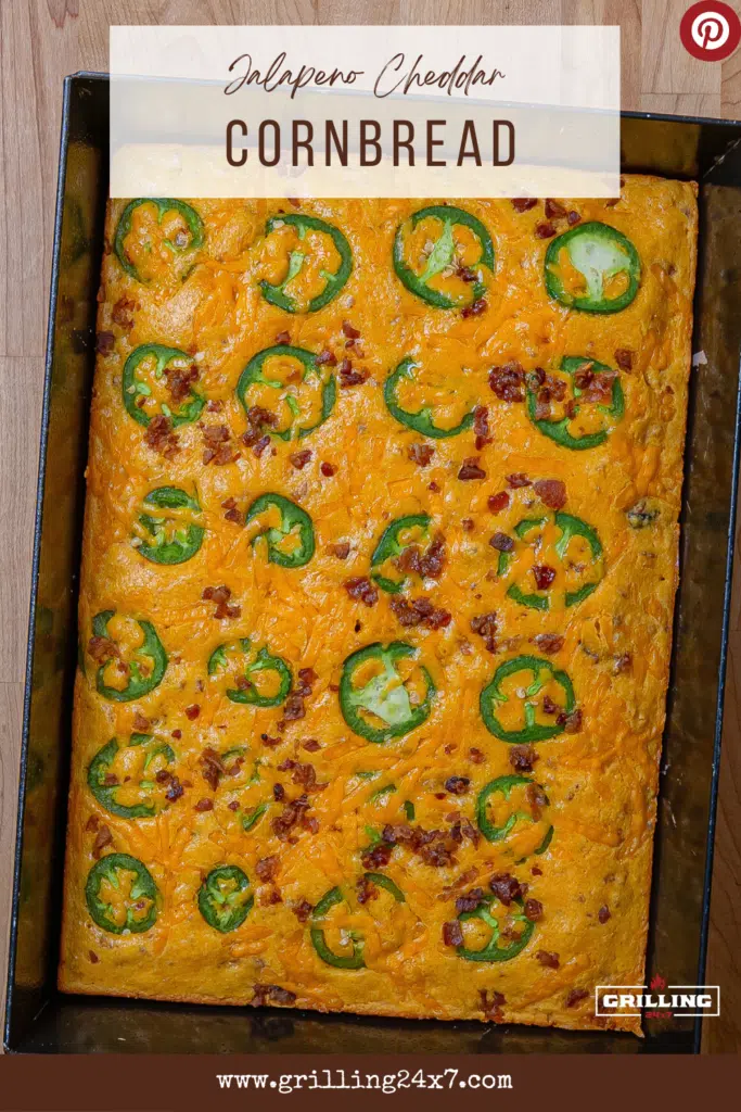 pan of cornbread topped with jalapeños and bacon