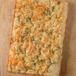 Whole loaf of focaccia bread with parmesan and rosemary