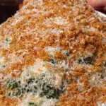 kale caesar topped with pecorino Romano and bread crumbs