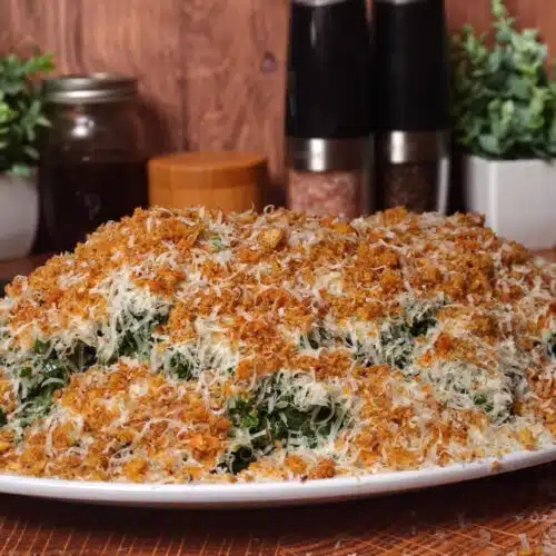 sprinting breadcrumbs onto the Kale Caesar salad
