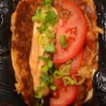 crab cake smash taco with tomato scallions and bang bang sauce