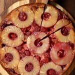pineapple upside down cornbread with a slice about to be removed