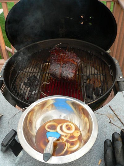 Smoking a pork shoulder on a charcoal grill
